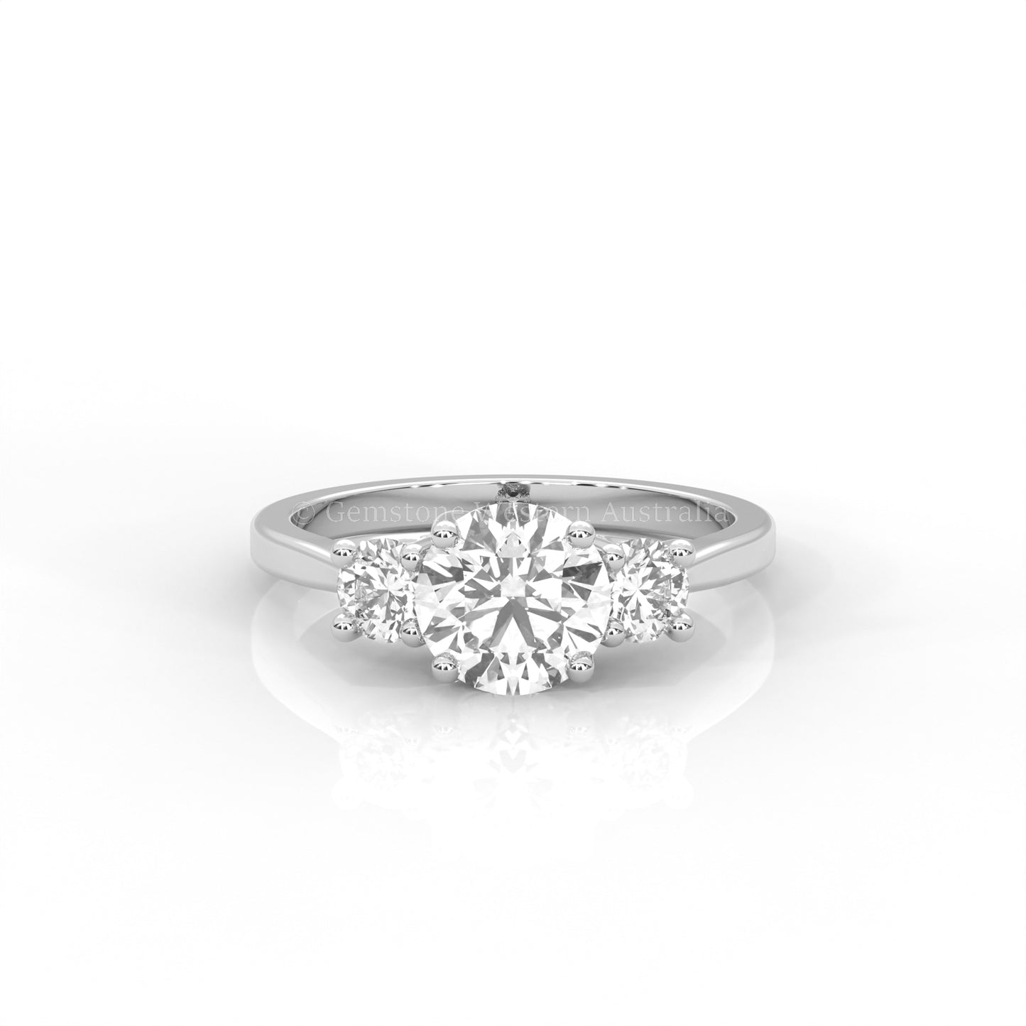 white gold three stone ring with round side diamonds and round centre stone on white background