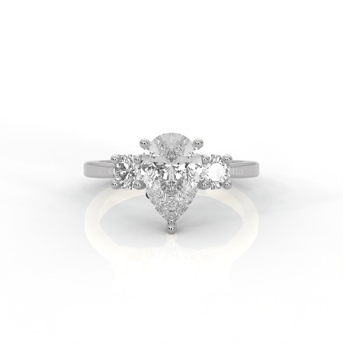 Three stone Platinum 950 ring with pear-cut centre diamond in white background