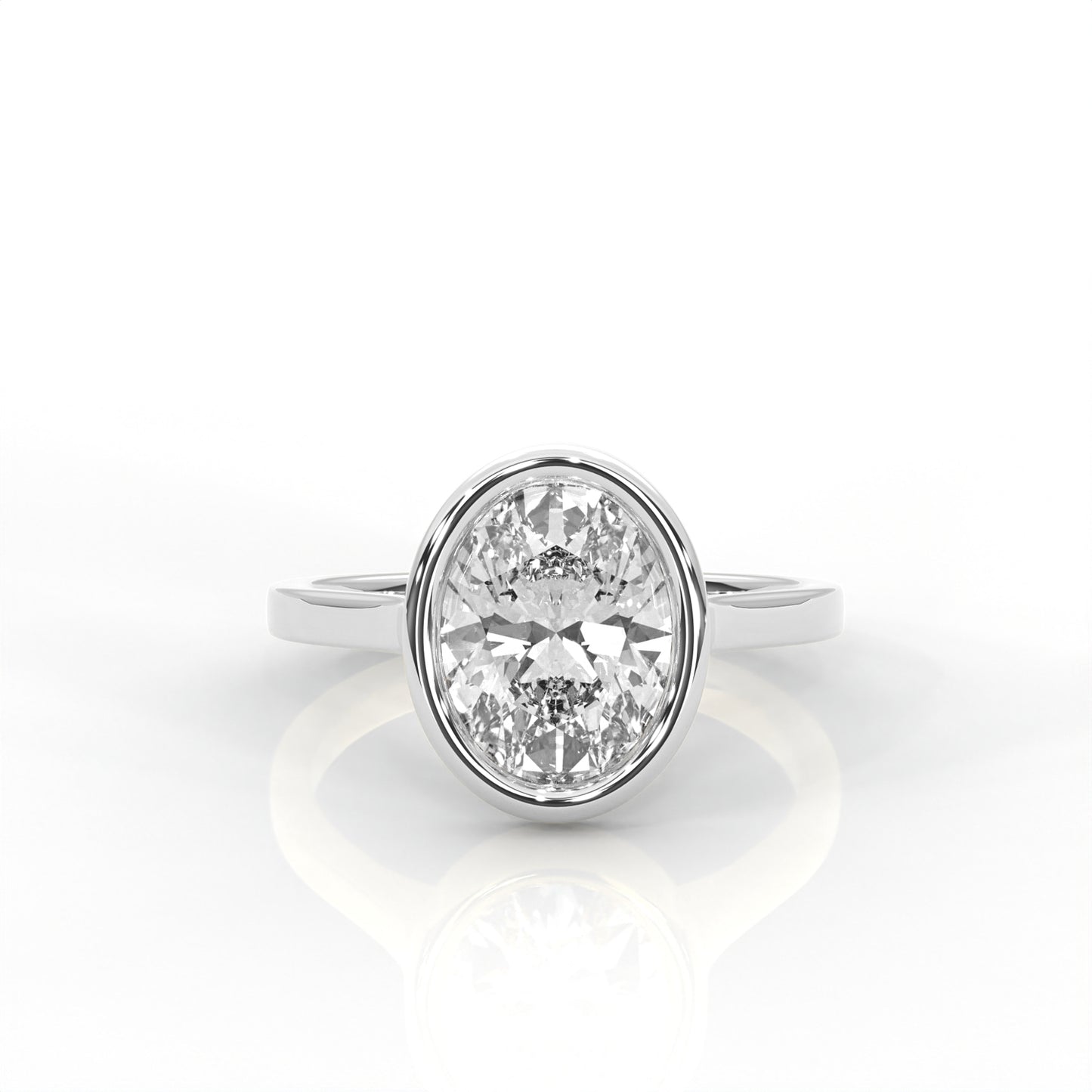 platinum Gold bezel set  ring with an Oval  diamond on a white background