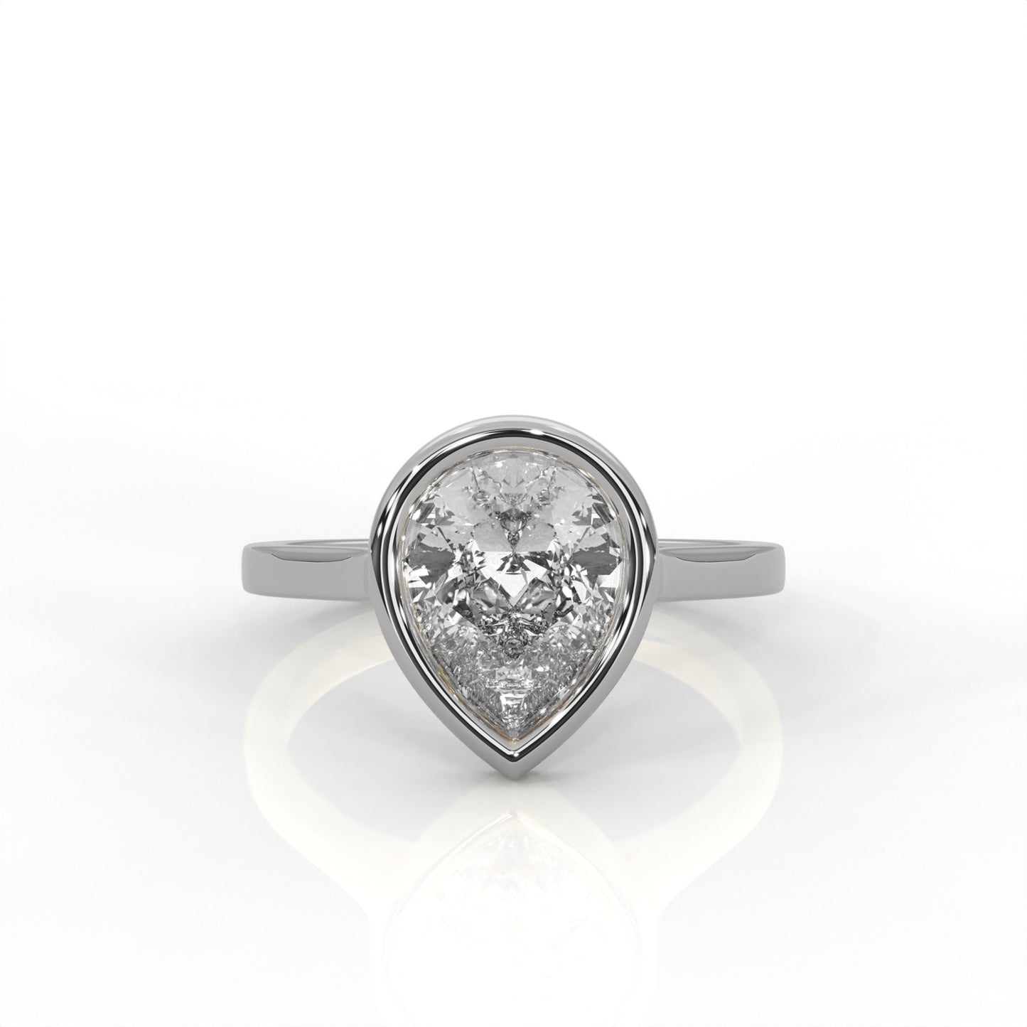 platinum  Gold ring with a pear-shaped diamond  Bezel set on a white 