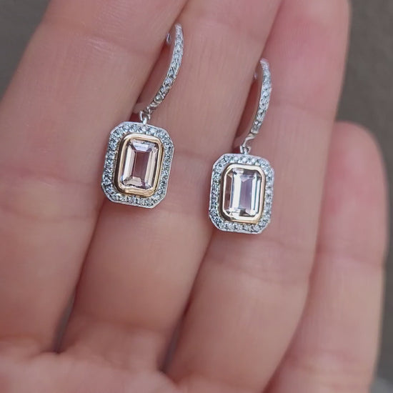 video on hand of morganite and diamonds gold earrings in light gray background
