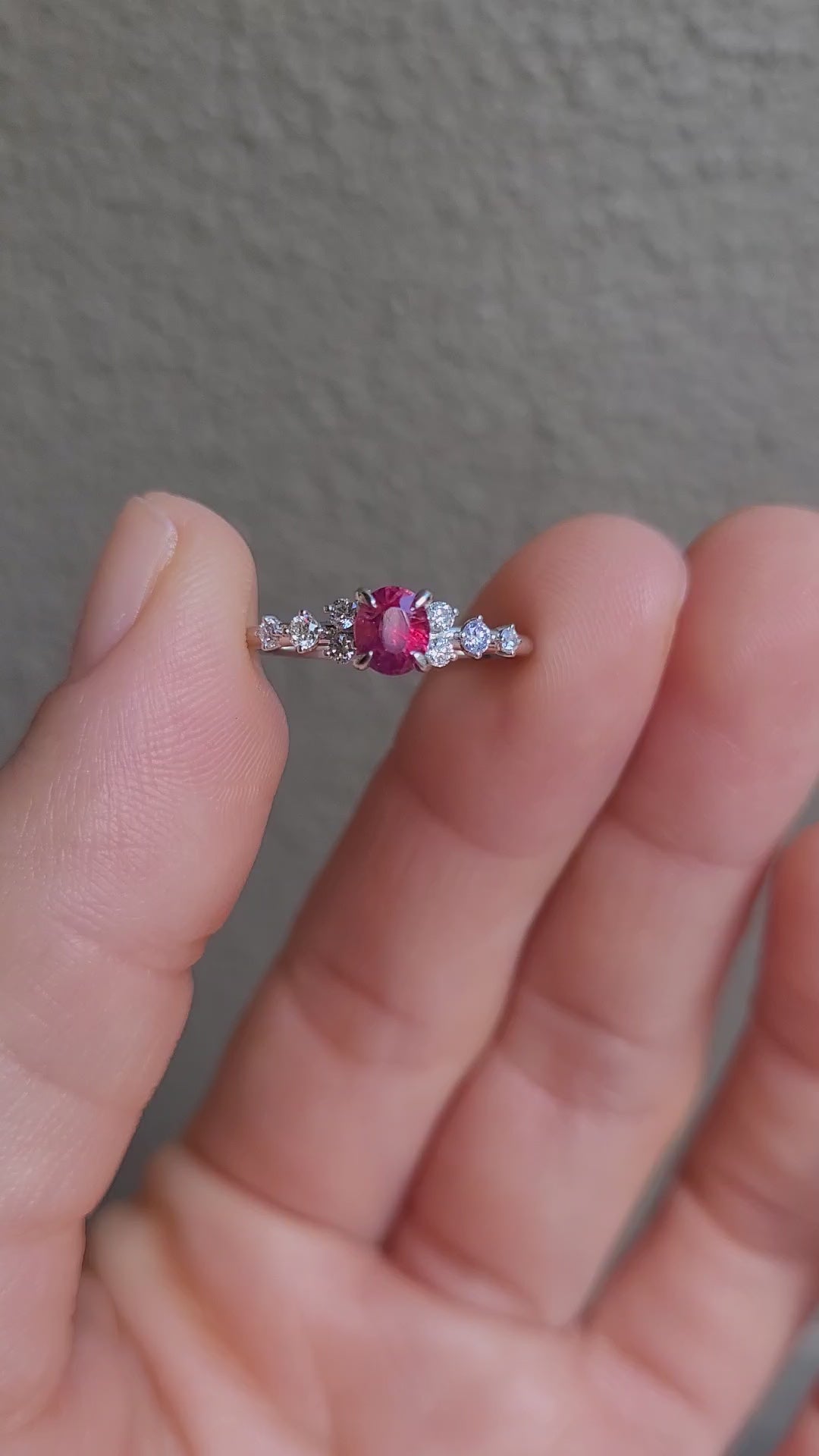 video of natural ruby and diamond ring in platinum 950 in neutral background