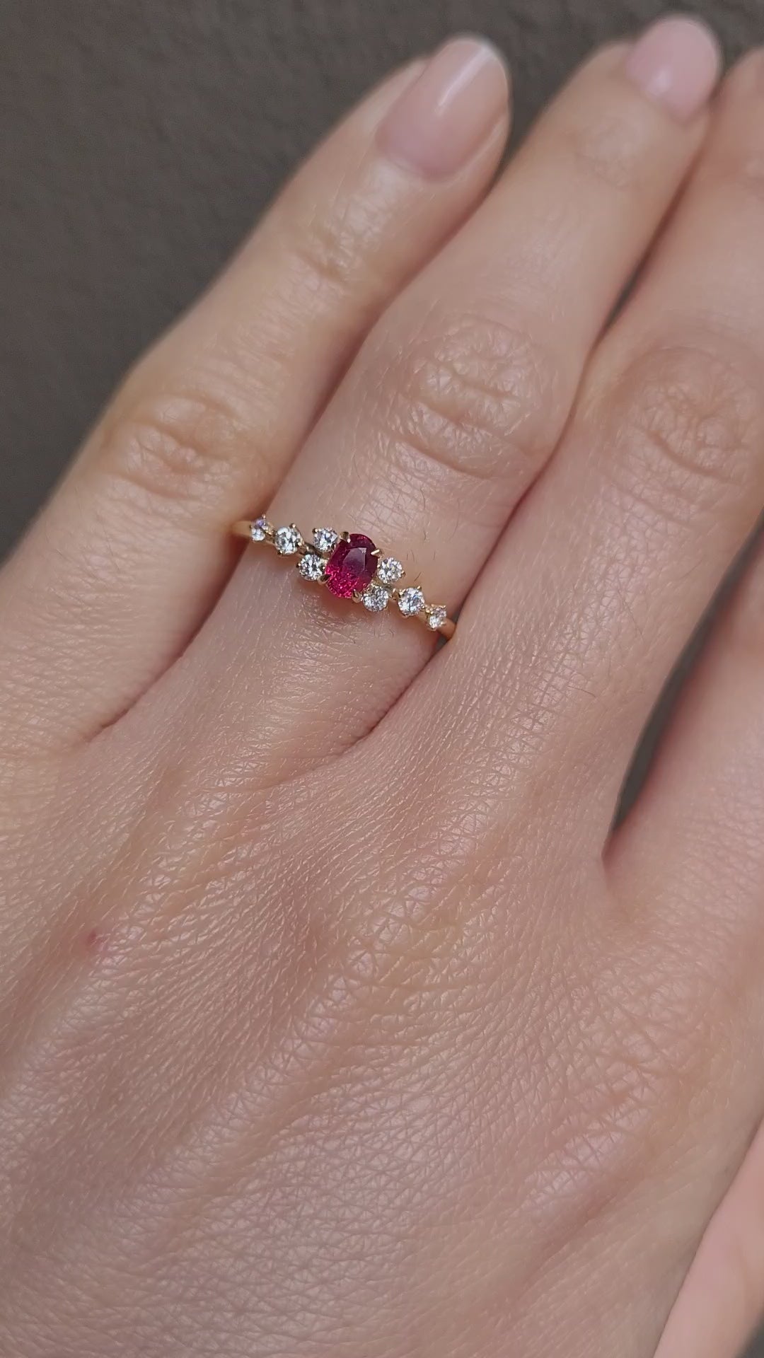 video of a Natural Ruby & Diamond Ring in 18K Yellow Gold worn on a hand in neutral background