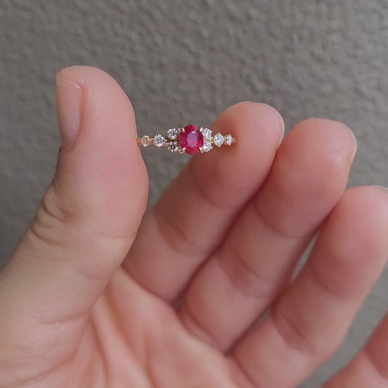 video of ruby and diamonds gold ring in yellow gold in neutral background