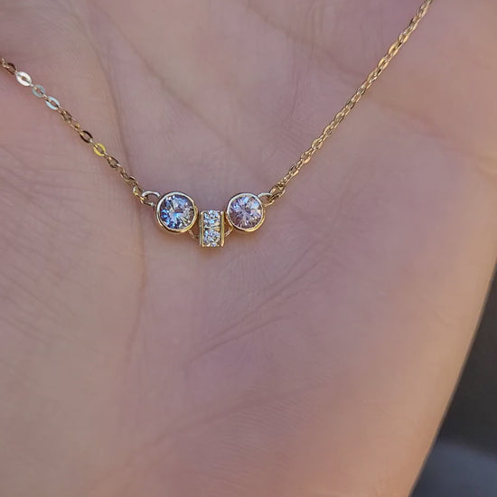 video of Pink Sapphire & Purple Blue Sapphire Diamond Pendant in 18K Yellow Gold held on hand 
