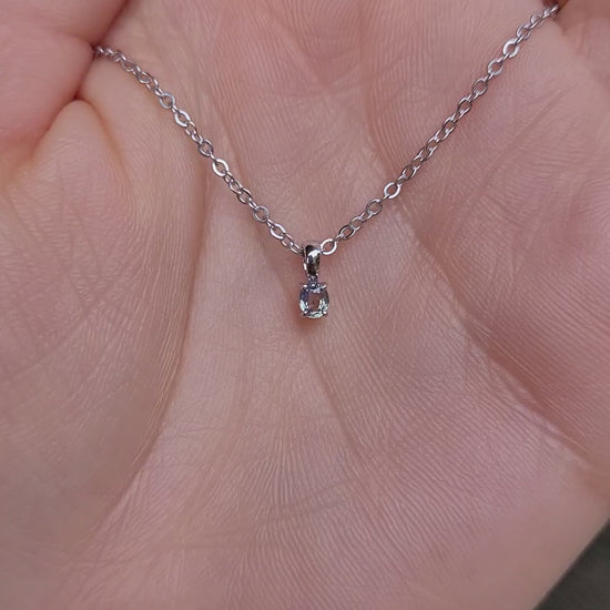 video of Alexandrite Pendant in Platinum 950 - 0.18ct Apple Green Hue under natural light