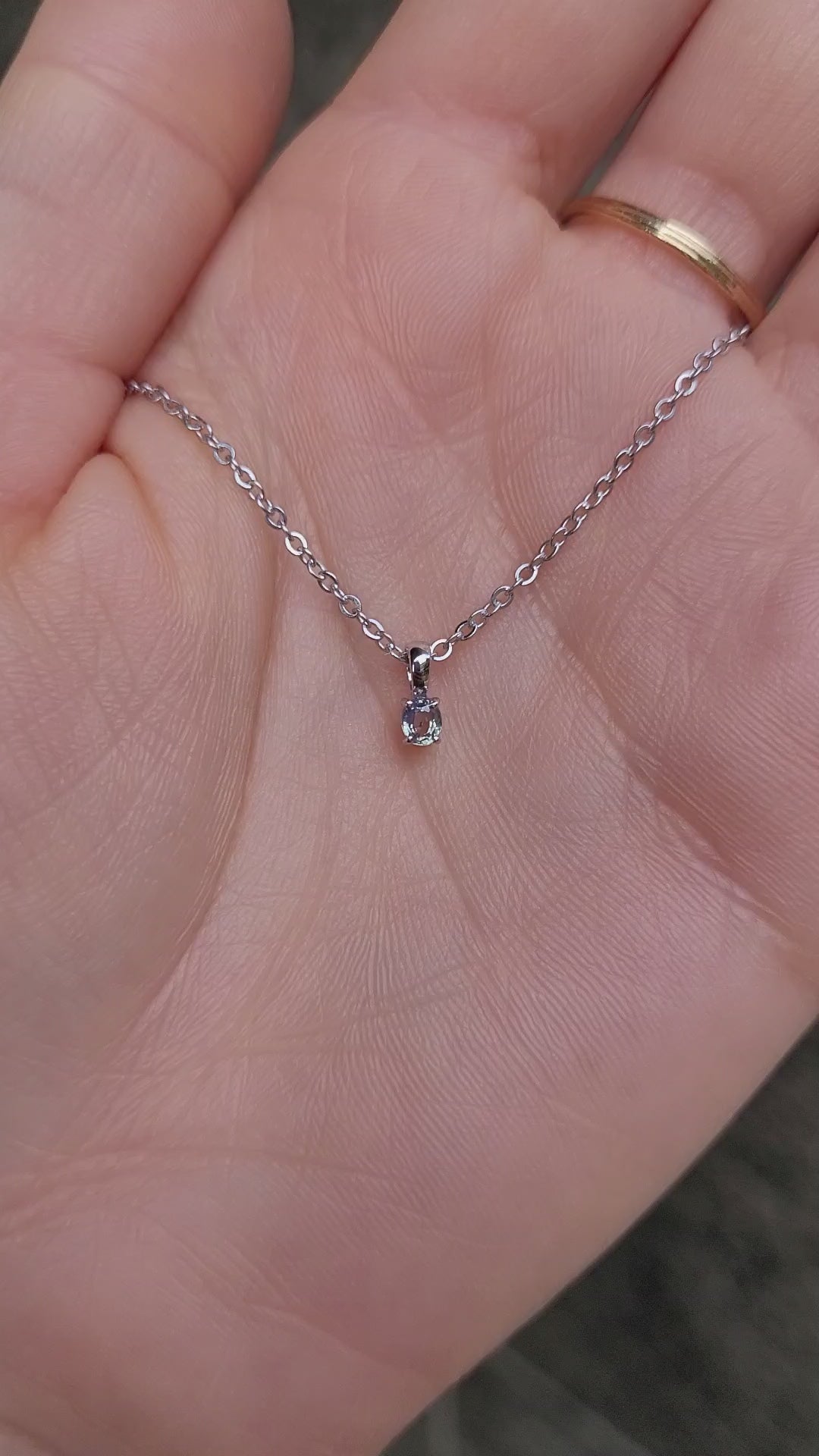 video of Alexandrite Pendant in Platinum 950 - 0.18ct Apple Green Hue under natural light