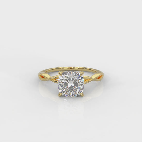 video of Yellow gold ring with cushion cut diamond and twisted band 