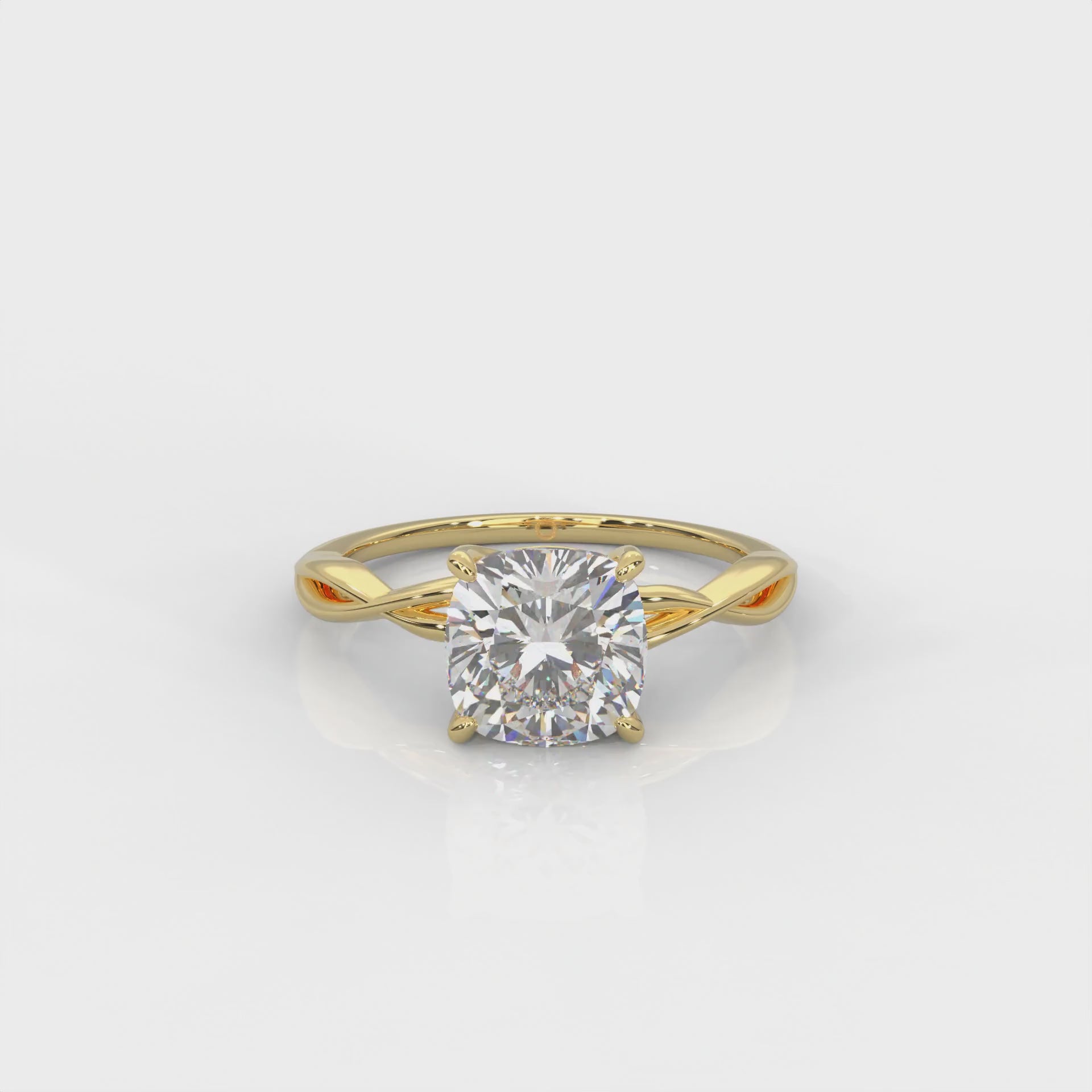 video of Yellow gold ring with cushion cut diamond and twisted band 