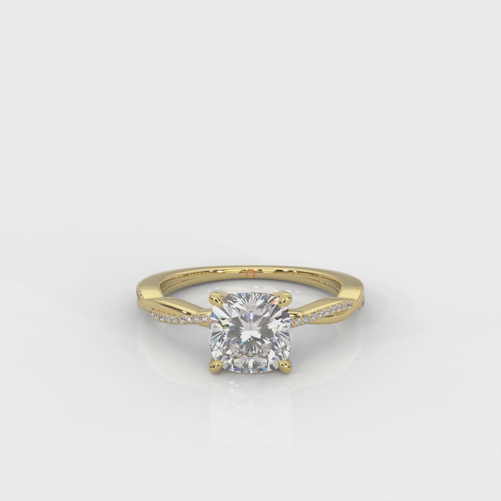 yellow gold ring with cushion-cut diamond and accent diamonds on a white background