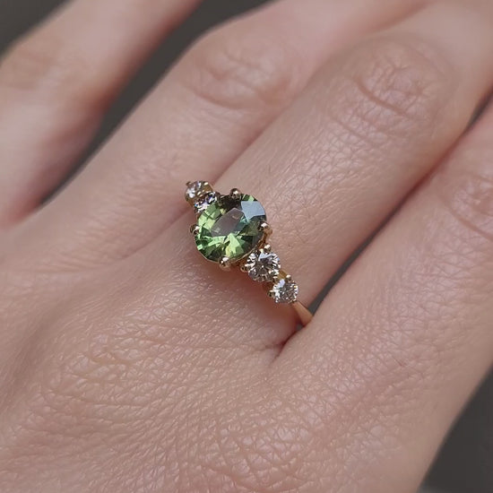 video of hand wearing Green Sapphire & Argyle Champagne Diamond Ring