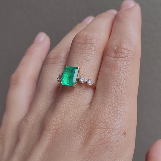 video of hand wearing a 2.29ct Natural Colombian Emerald Ring with GIA Diamonds 