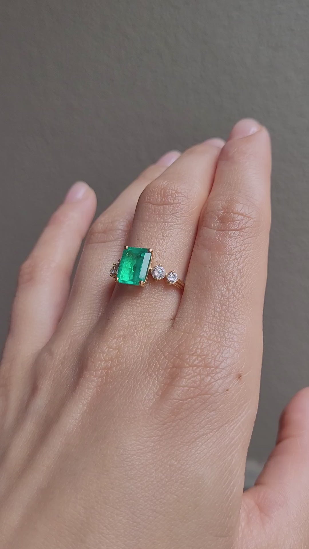 video of hand wearing a 2.29ct Natural Colombian Emerald Ring with GIA Diamonds 