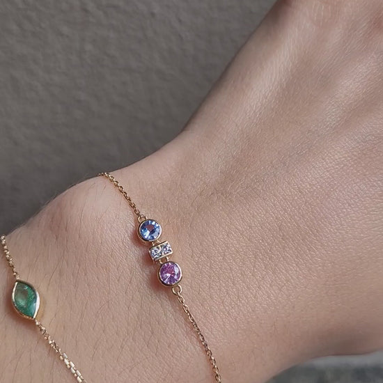 video of Pink and Blue Sapphire Diamond Bracelet in 18K Yellow Gold worn in wrist in neutral background