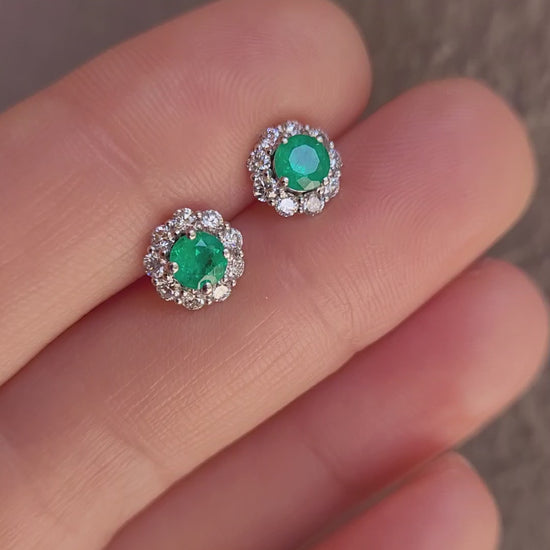 video of Colombian Emerald earrings held in hand