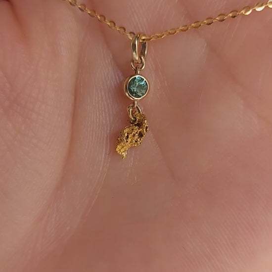 video on hand of second sapphire and gold nugget pendant