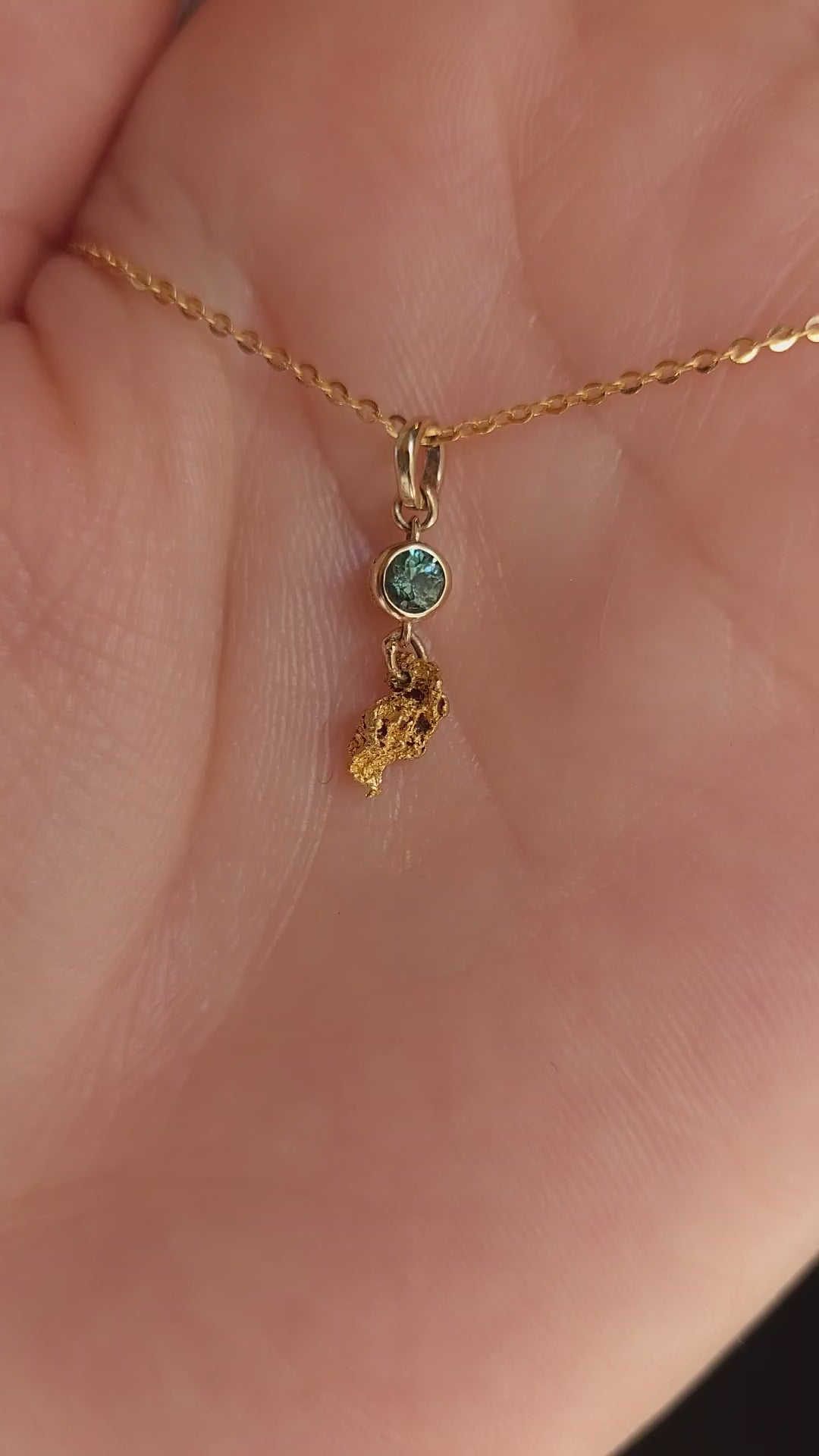 video on hand of second sapphire and gold nugget pendant