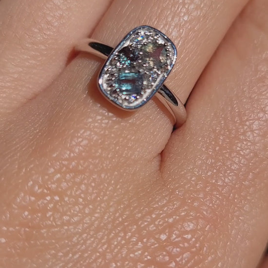 video of a hand wearing a Natural Alexandrite & Diamond Composition Ring in Platinum under natural light
