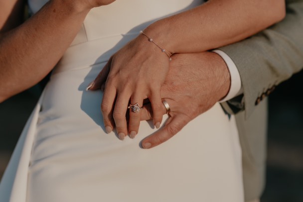 Woman Wearing a Pink Sapphire Diamond Ring