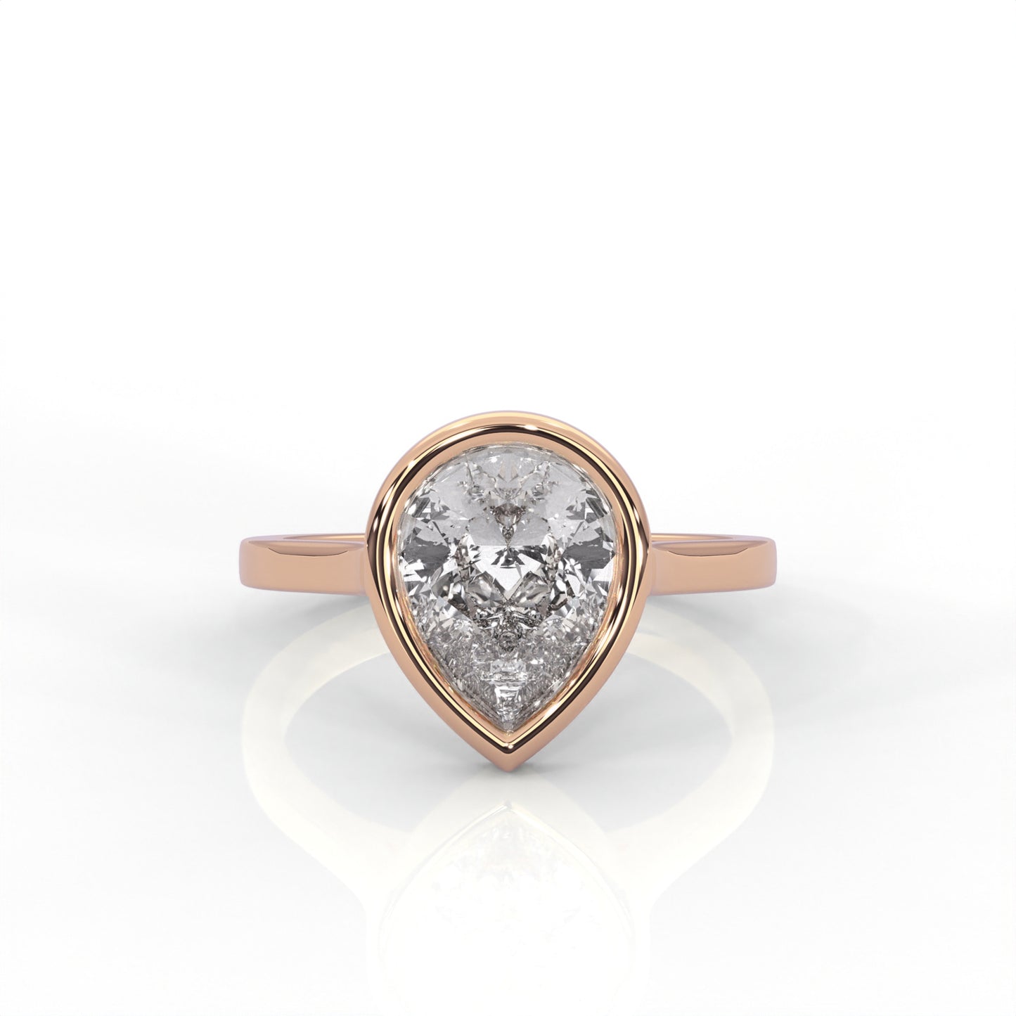 rose  Gold ring with a pear-shaped diamond  Bezel set on a white 