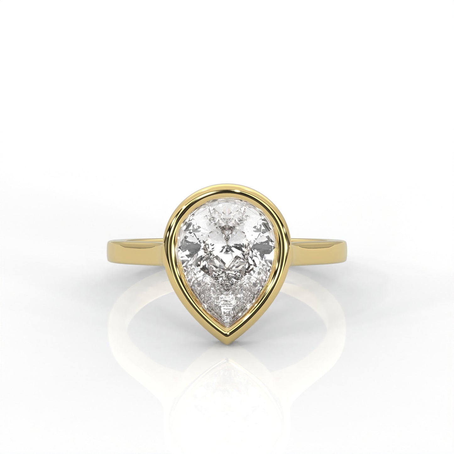 yellow Gold ring with a pear-shaped diamond  Bezel set on a white background