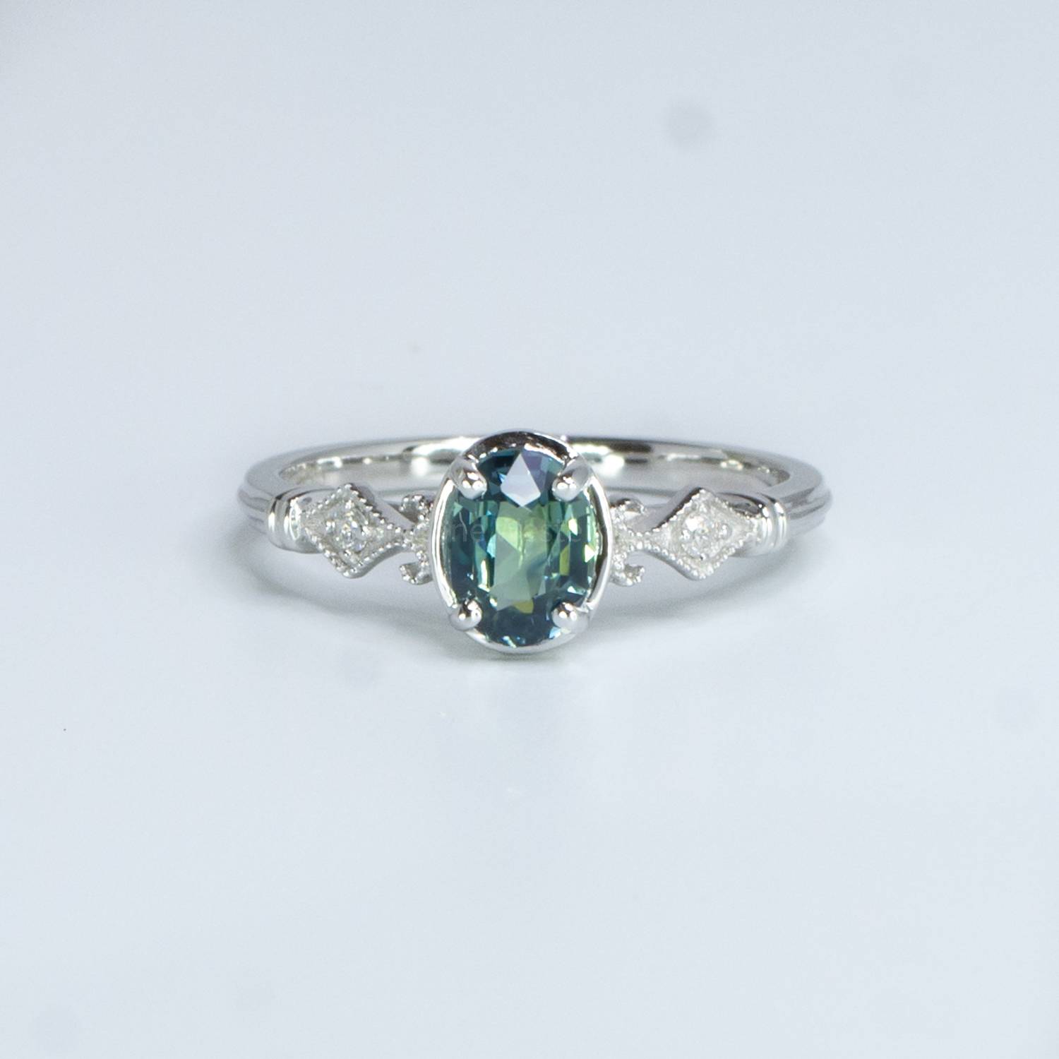 3.81ct Old Emerald Cut Diamond and Sapphire Halo Ring | Hancocks London
