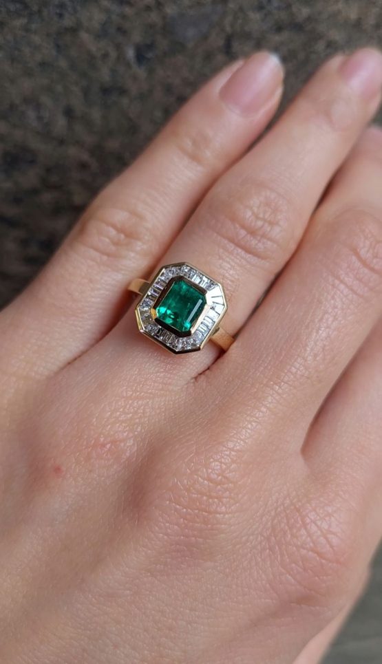 view on hand of Emerald Cut Colombian Emerald Ring with Baguette Diamond Halo - 1982858