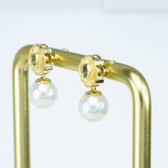 alt="pearl earrings side view"