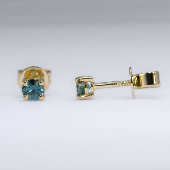 Front and side view of Australian teal sapphire stud earrings in 18K yellow gold