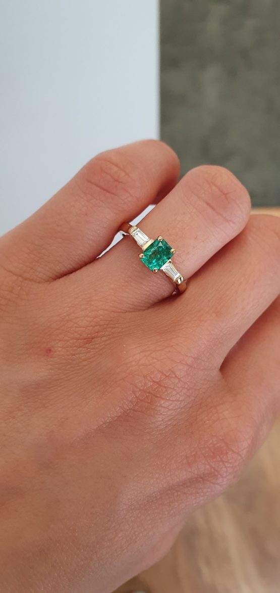 view on hand of Natural Colombian Emerald Ring with Tapered Diamonds in 18K Yellow Gold - 1982781