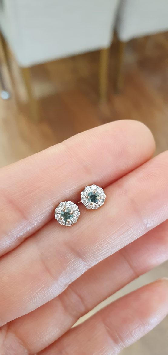 view on hand of Natural Teal Sapphire Stud Earrings in 9K White Gold with Moissanite Halo - 1982784