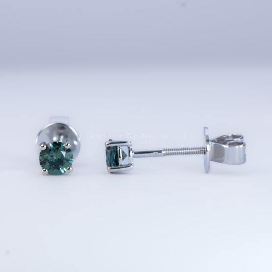 front and side view of Australian Teal Sapphire Stud Earrings in 18K White Gold – 0.58ct Round Cut - 1982779