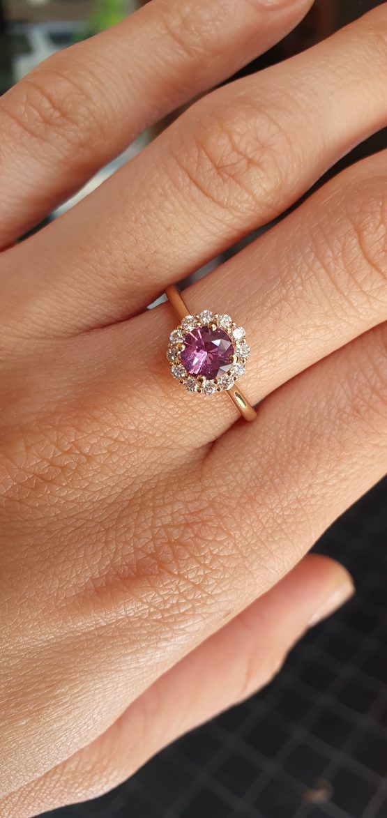 view on hand of Unheated Round Pink Sapphire Halo Ring in 18K Yellow Gold -