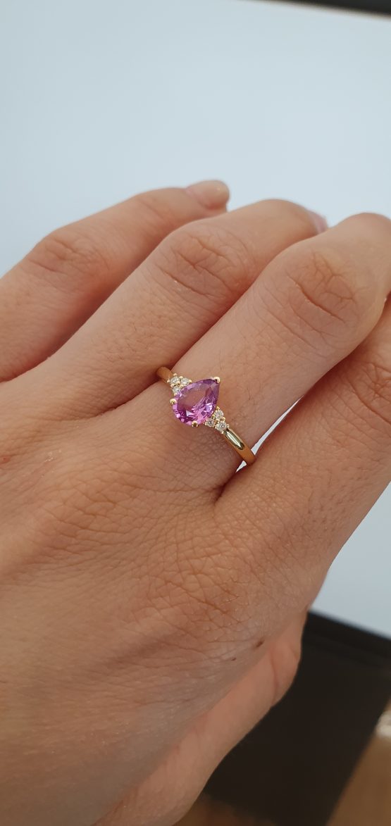 View on hand of Pear Cut Natural Unheated Pink Sapphire Ring in 18K Yellow Gold - 1982793