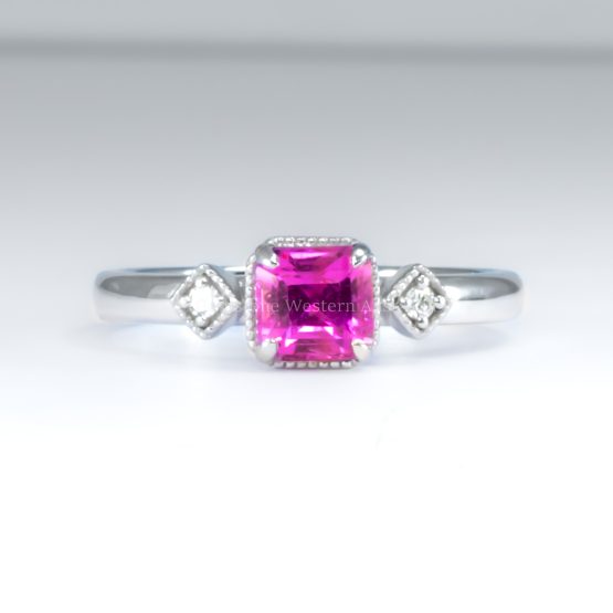 front view on white background of 1.05ct Natural Unheated Emerald Cut Pink Sapphire Ring in Platinum 950 with Diamond Accents and Filigree Detail