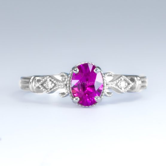 Front view on white background of Oval Cut Pink Sapphire and Diamond Ring in Platinum 950 with Filigree Detail