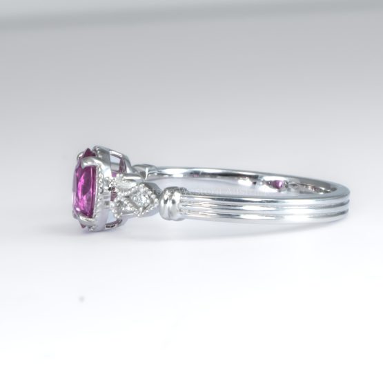 side view on white background of Oval Cut Pink Sapphire and Diamond Ring in Platinum 950 with Filigree Detail