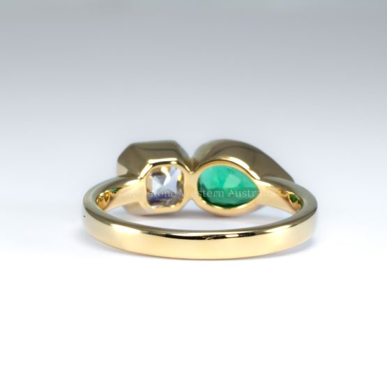 back view of toi et moi ring with 1ct natural diamond and 1ct Colombian emerald