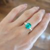 photo on hand of 2.29ct Natural Colombian Emerald Ring with GIA Diamonds in 18K Yellow Gold