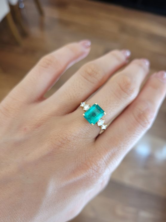 photo on hand of 2.29ct Natural Colombian Emerald Ring with GIA Diamonds in 18K Yellow Gold