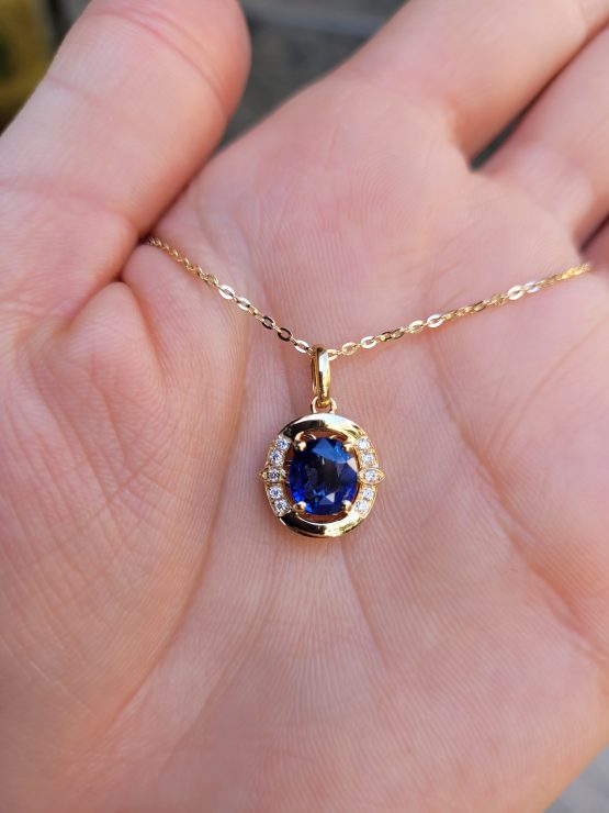 view on hand 1.57ct Natural Blue Sapphire Pendant Necklace with Diamond Accents in 18K Yellow Gold