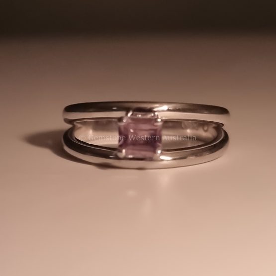 front view in candle light of Emerald-Cut Alexandrite Floating Ring