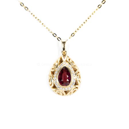 front view of Pear Shape Unheated Ruby Pendant with Diamond Halo in Elegant Drop Design