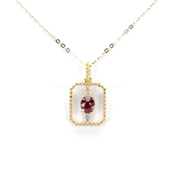 close-up view of 0.54ct Natural Ruby Pendant in 18K Yellow Gold with Diamond Accents