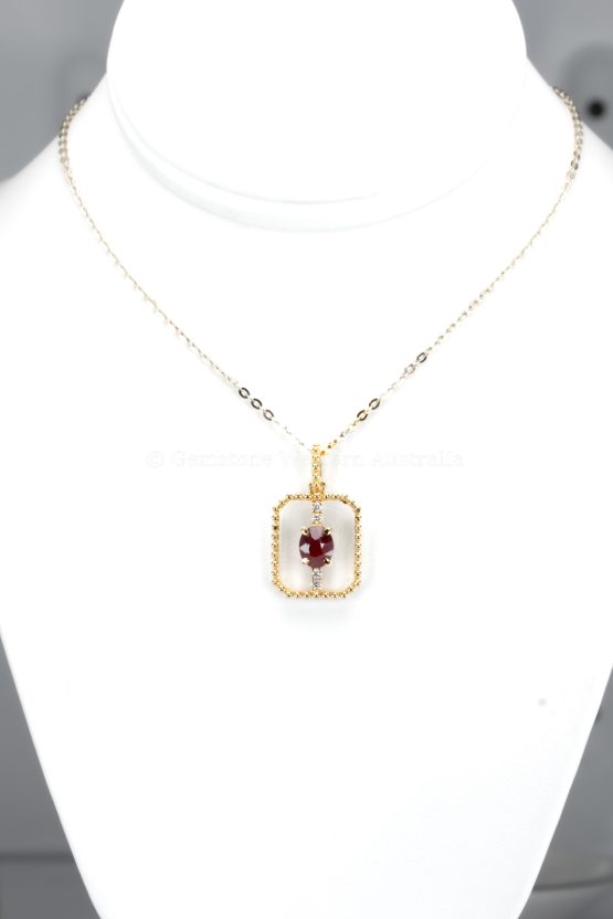 front view of 0.54ct Natural Ruby Pendant in 18K Yellow Gold with Diamond Accents