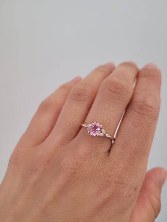 photo on hand of Unheated 1.34ct Baby Pink Sapphire Ring with Marquise Diamond Accents in 18K Yellow Gold