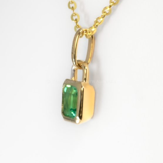 second side view photo of 0.33ct Vivid Green Colombian Emerald Pendant in 18K Yellow Gold