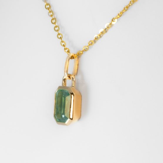 side view of 0.91ct Natural Elongated Emerald Cut Emerald Pendant | 18K Yellow Gold