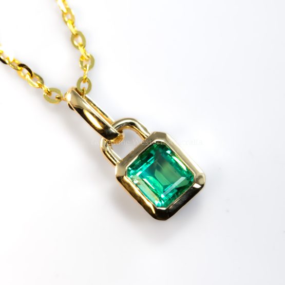 birds eye view photo of 0.33ct Vivid Green Colombian Emerald Pendant in 18K Yellow Gold