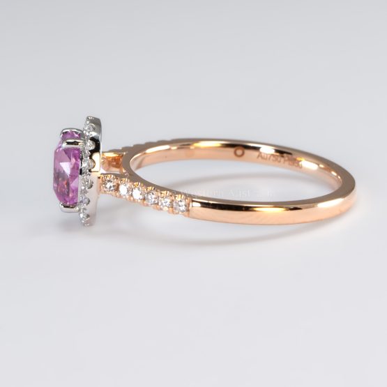 side view of 1.08ct Oval Pink Sapphire Halo Ring in Platinum and 18K Rose Gold